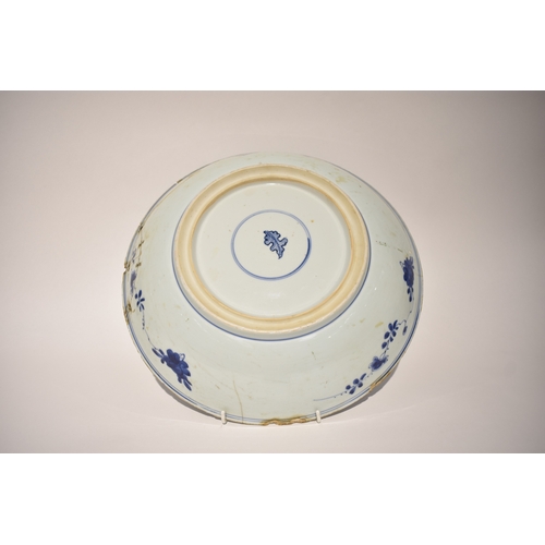 4318 - A late 18th/early 19th Century Chinese blue & white bowl with rivet repairs, all over flower and lea... 