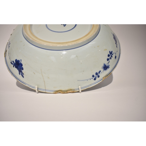 4318 - A late 18th/early 19th Century Chinese blue & white bowl with rivet repairs, all over flower and lea... 