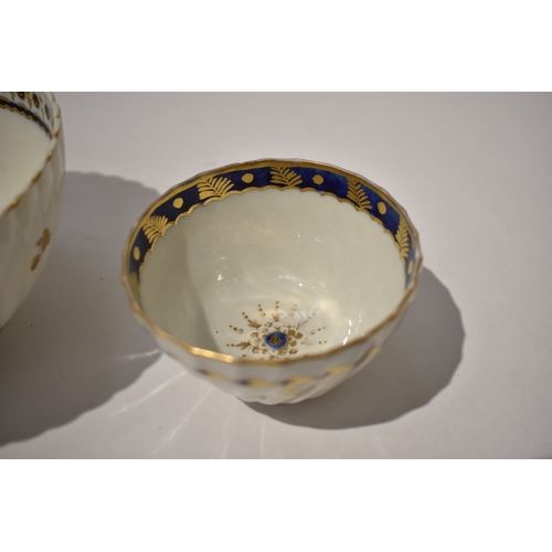 4429 - A Caughley fluted slop bowl and similar tea bowl