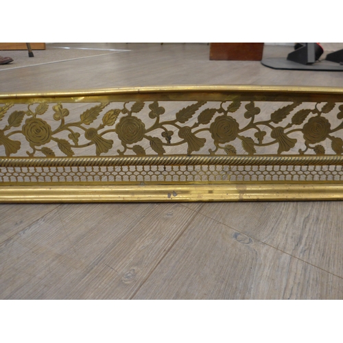 4199 - A Scottish 19th Century pierced brass fire fender with thistle decoration, 138cm long