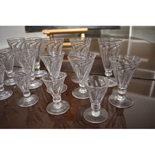 4481 - A suite of Georgian wrythen form glasses of three varying sizes (17)