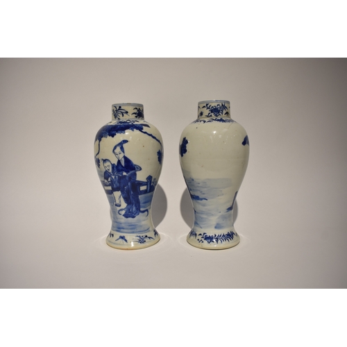 4034 - A pair of Kangxi period bulbous vases decorated with mother and children playing in garden setting, ... 