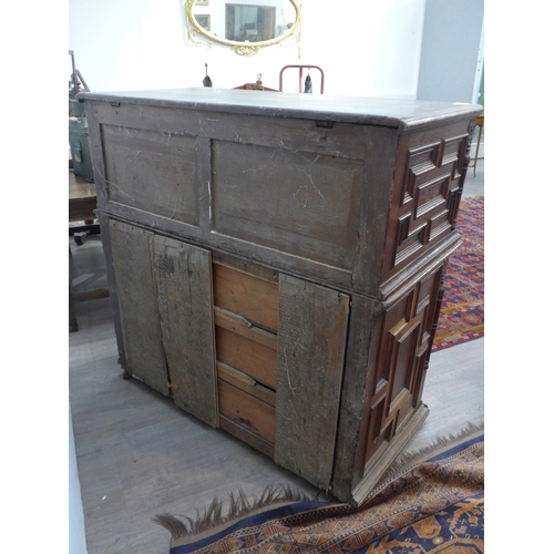 4168 - A late 17th/18th Century oak coffer on cupboard base with drawers to the interior, geometric moulded... 