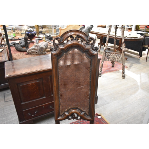 4227 - An English 17th Century carved William and Mary walnut cane back and seat chair, with acanthus scrol... 