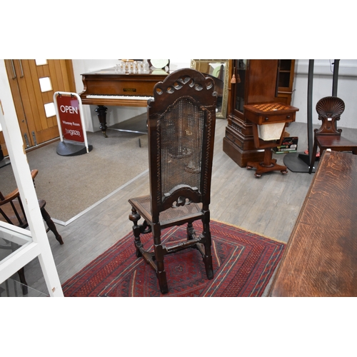 4227 - An English 17th Century carved William and Mary walnut cane back and seat chair, with acanthus scrol... 