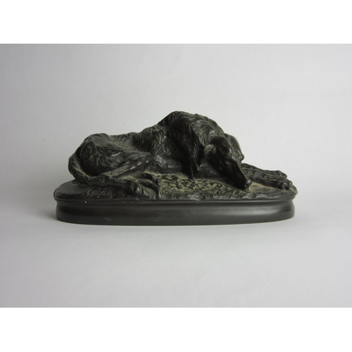 4415 - A bronze figure of a sleeping Afghan Greyhound, marked 