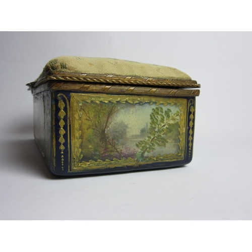 4430 - An enamelled trinket box, hand painted panels of landscapes, enriched with gilt, needlepoint lid