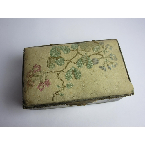 4430 - An enamelled trinket box, hand painted panels of landscapes, enriched with gilt, needlepoint lid