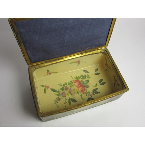 4430 - An enamelled trinket box, hand painted panels of landscapes, enriched with gilt, needlepoint lid