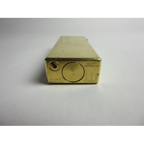 4461 - A Dunhill yellow metal cigarette lighter