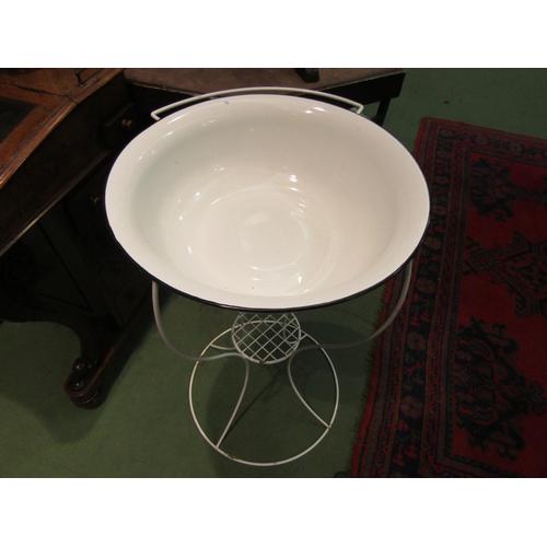 4006 - An enamel wash bowl on stand 83cm high, bowl 49cm diameter