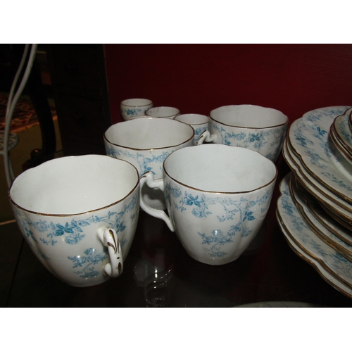 4007 - A collection of Foley china ware, white ground with blue floral design