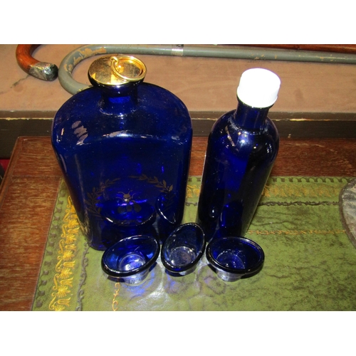 4018 - A collection of vintage French cobalt blue glass, a bottle 18cm x 9cm x 5cm with gold coloured stopp... 