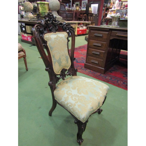 4138 - An early Victorian rosewood ornately carved chair with acanthus leaf decoration and scroll foot fore... 