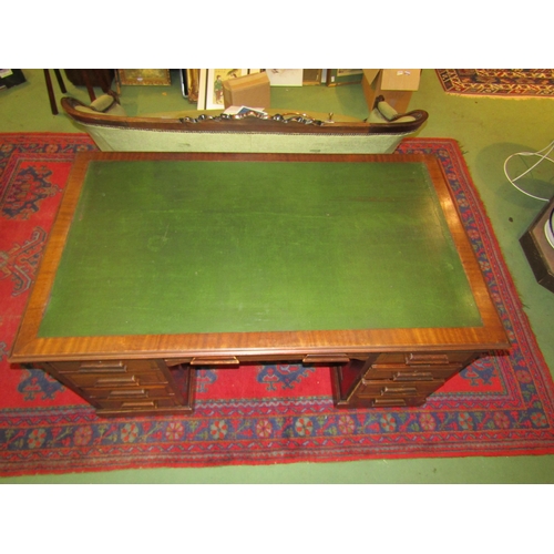 4139 - A circa 1930 vintage panelled mahogany twin pedestal desk with brushing slides over eight drawers on... 