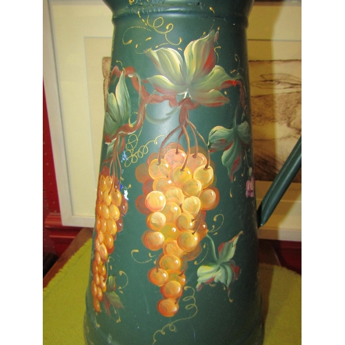 4149 - A decorative metal jug hand painted with a flowers/grapes motif in a Canalware style, height 40cm x ... 