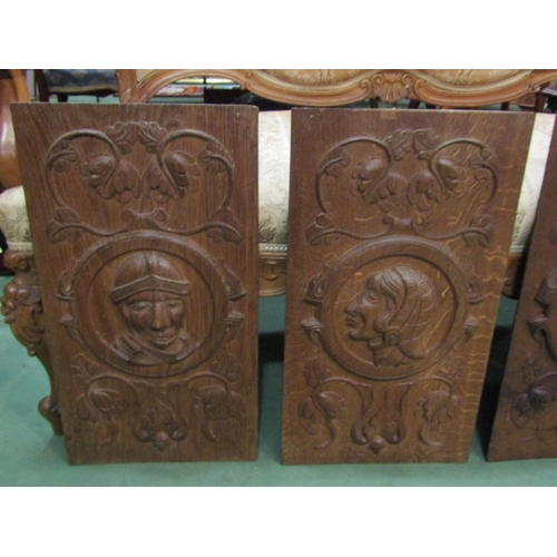 4152 - Four wooden panels carved with profiles in an Elizabethan style, 57cm x 31cm