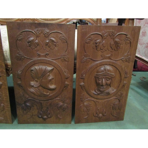 4152 - Four wooden panels carved with profiles in an Elizabethan style, 57cm x 31cm