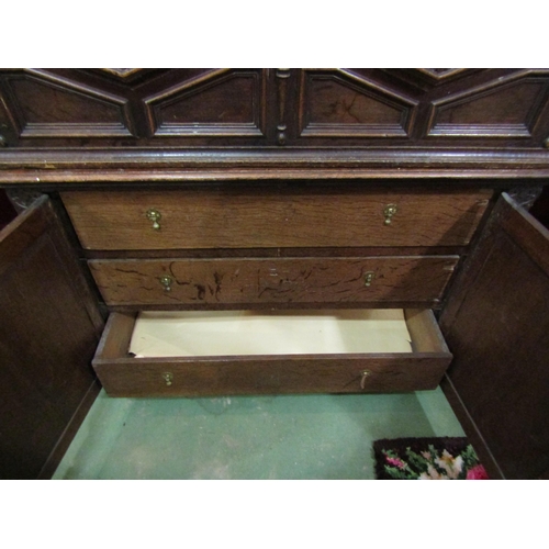 4168 - A late 17th/18th Century oak coffer on cupboard base with drawers to the interior, geometric moulded... 