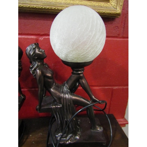 4205 - A pair of Art Deco style figural table lamps, semi-clad maidens with globular shades