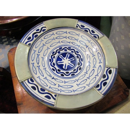 4209 - A hand painted terracotta wall charger with fish design and metal overlay, 42cm diameter