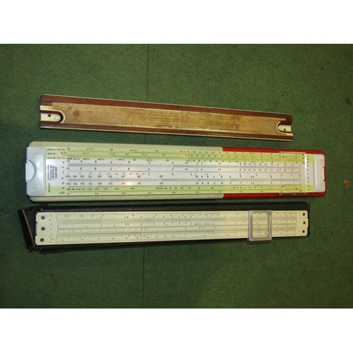 4250 - A group of miscellaneous to include slide rules, commemorative spoons, a Ronson lighter, a pair of b... 