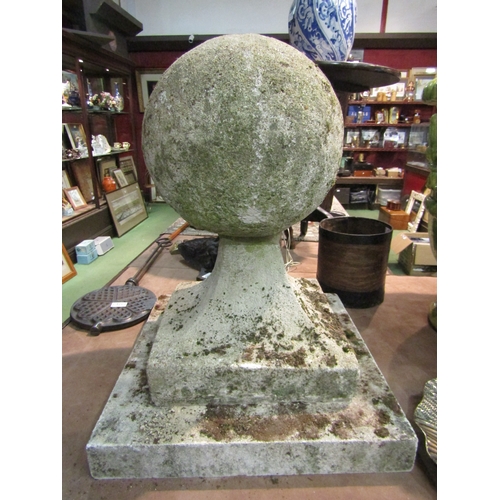 4258 - A pair of reconstituted stone ball finial gate post cappings, approximately 62cm tall