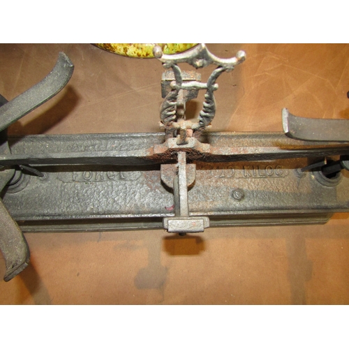 4261 - A pair of cast iron weighing scales with weights and brass pans