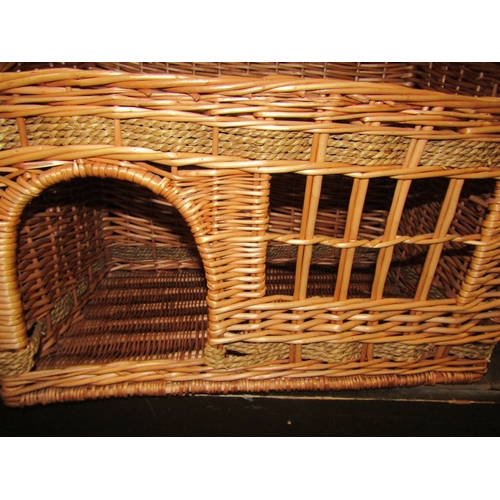 4301 - A wicker cat house basket, 56cm long x 32cm tall