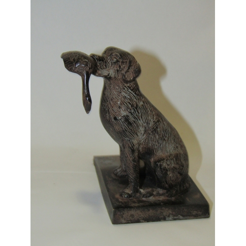 4325 - A metal doorstop in the form of a Labrador 12.5cm tall, together with a figure of two leopards