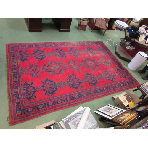 4555 - A Turkish wool hand-knotted rug in red, blues and green, floral pattern with multiple borders, worn,... 