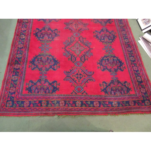 4555 - A Turkish wool hand-knotted rug in red, blues and green, floral pattern with multiple borders, worn,... 