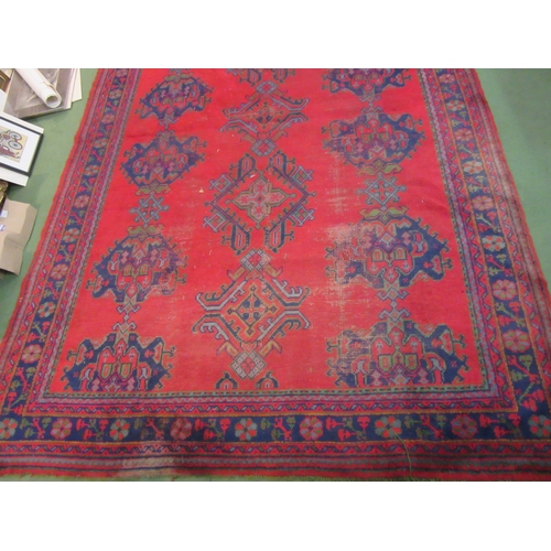 4555 - A Turkish wool hand-knotted rug in red, blues and green, floral pattern with multiple borders, worn,... 