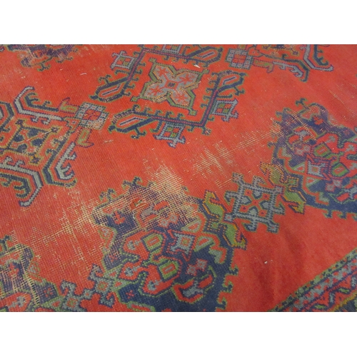 4555 - A Turkish wool hand-knotted rug in red, blues and green, floral pattern with multiple borders, worn,... 