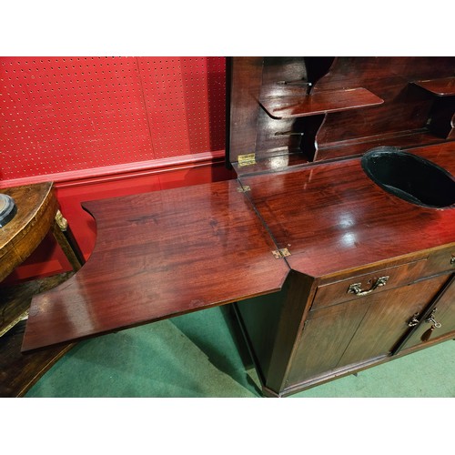 4044 - A French 19th Century mahogany canted corner buffet/sideboard, the rising hinged top with shelf supp... 