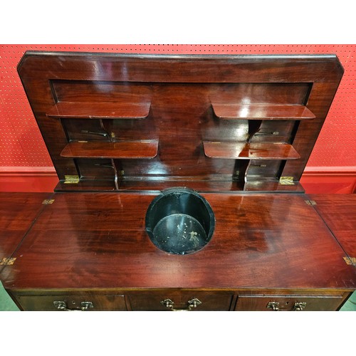 4044 - A French 19th Century mahogany canted corner buffet/sideboard, the rising hinged top with shelf supp... 