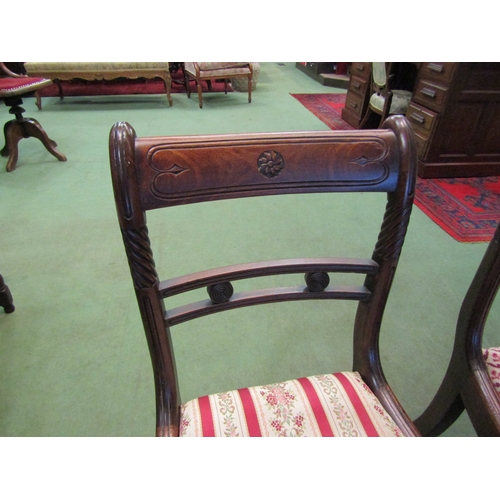 4088 - A pair of Regency mahogany chairs with carved and spiral decoration on square fore legs