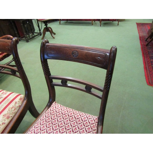 4088 - A pair of Regency mahogany chairs with carved and spiral decoration on square fore legs