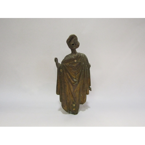 4369 - A brass figure dressed in classical costume, 22cm tall