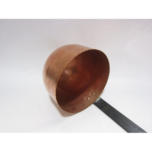 4387 - An oversized French copper ladle with iron handle and deep bowl marked 