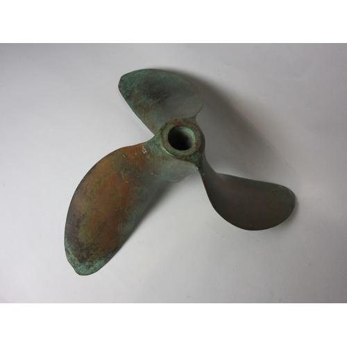 4547 - A vintage French bronze tri-lobe boat propeller, radius 24cm, shaft 3cm, with verdigris patination