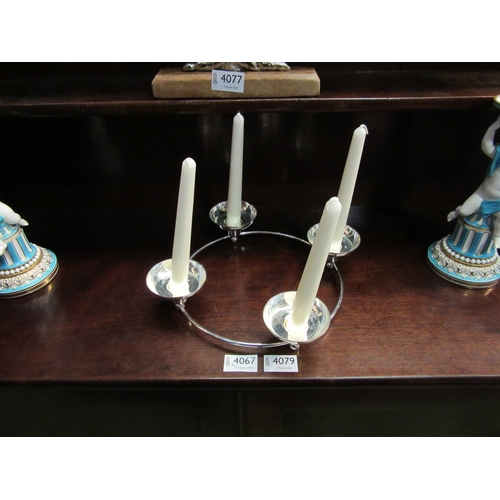 4077 - A silver plated circular four sconce candle holder together with a metal 