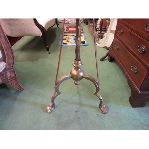 4211 - A brass and copper standard lamp, extendable column on tripod base