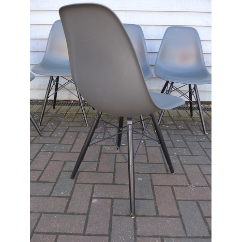 9314 - A set of six Vitra DSW chairs designed by Charles Eames in dark grey with black painted wooden bases... 