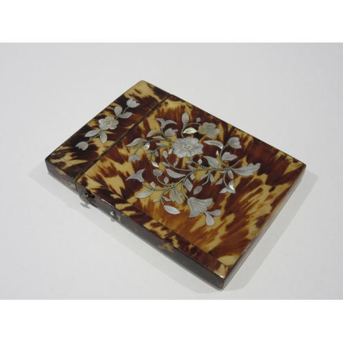 1334 - A Victorian tortoiseshell card case with inlaid mother-of-pearl floral decoration