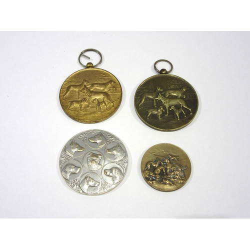 1349 - A collection of four French dog show medals, including one in silvered bronze by artist Lucien Caria... 