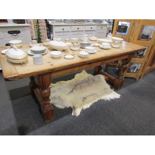 1127 - An 18th Century revival stripped pine farmhouse refectory dining table, the cleated end planked top ... 