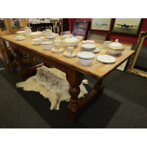 1127 - An 18th Century revival stripped pine farmhouse refectory dining table, the cleated end planked top ... 