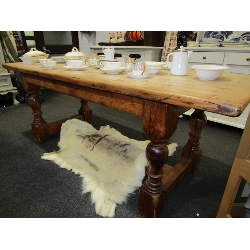 1127 - An 18th Century revival stripped pine farmhouse refectory dining table, the cleated end planked top ... 