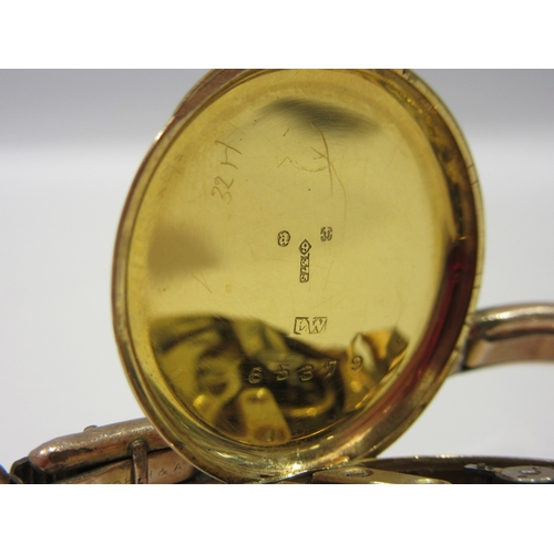 1380 - A lady's 9ct cased wristwatch with enamelled Roman numeral dial, total weight 19g